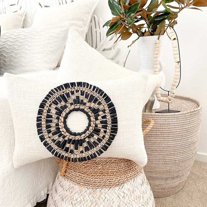 White cushion with black and natural seagrass cushion accessory. Ethnic and boho style cushions. Cushion covers 35x50