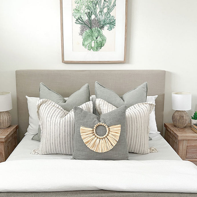 Sage green cushion for a coastal inspired home. Featuring a bamboo cushion accessory.