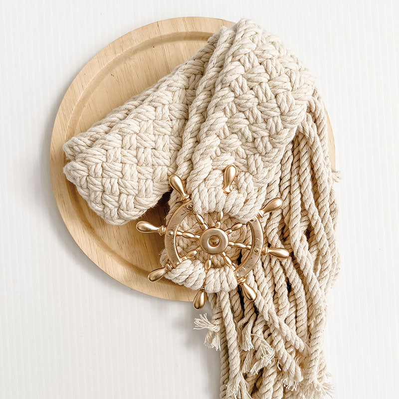 Nautical cushion featuring a sailors wheel, perfect for a coastal home. Nautical Cushion Accessory 