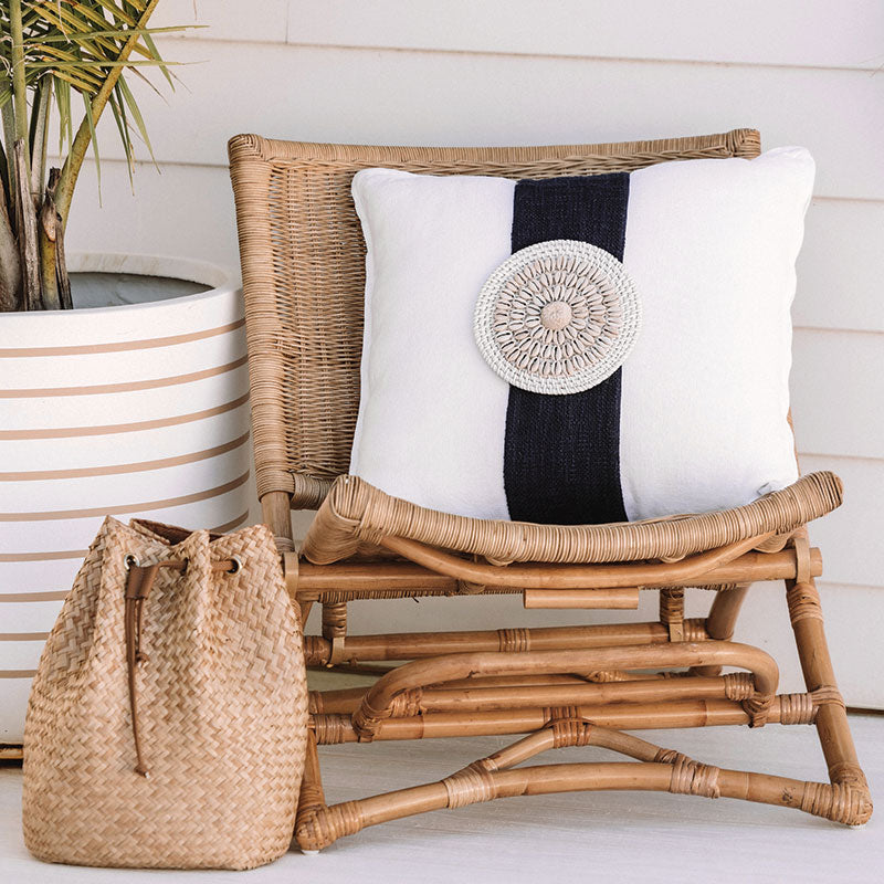 White coastal cushion with a rattan and shell disk, the perfect beach pillows for your coastal home. White coastal Cushion covers 50x50 - Square cushion covers.