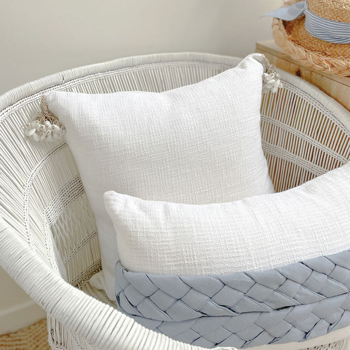 white cotton cushion with shell tassels. Perfect for coastal decorating in your coastal home. White  Cushion covers 50x50 
