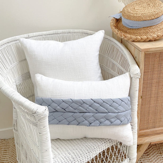White cushion with blue plait wrap. Creating a Coastal, Hamptons, Cottage or Classic style home, this cushion will be the perfect accent piece. Size: 35 x 50cm 