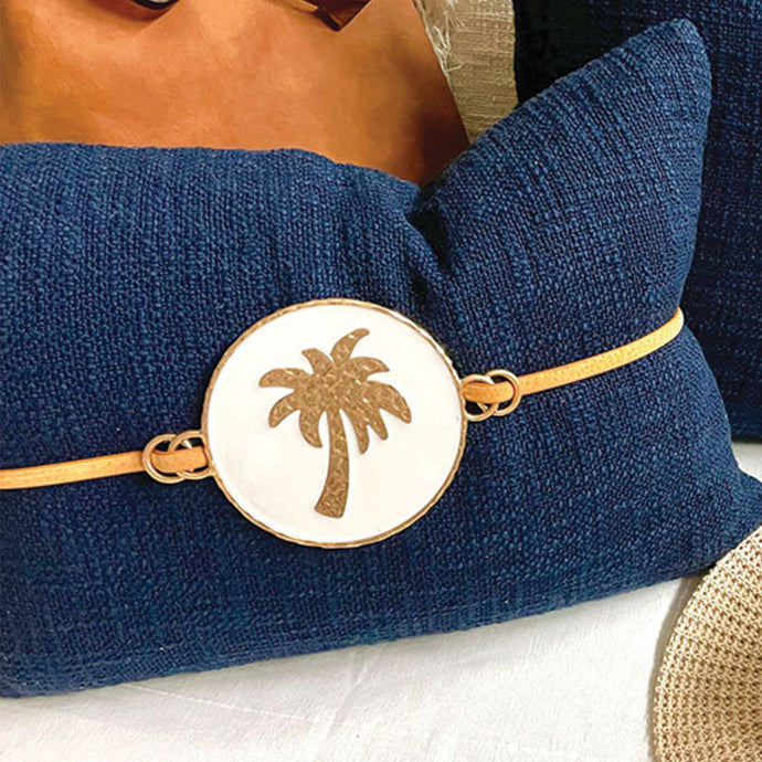 Luxe Navy palm cushion with tan suede strap to compliment your resort style home or tropical room. 35cm x 35cm