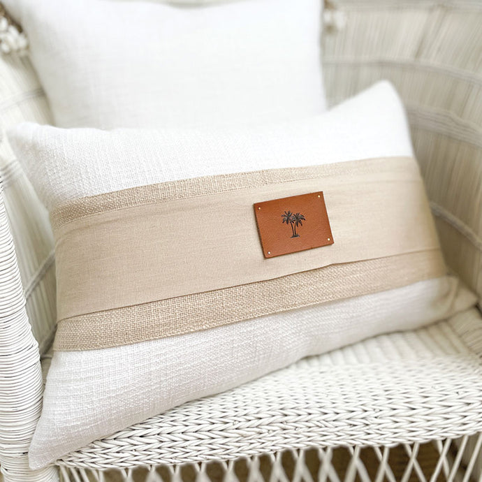 A neutral colour coastal cushion that can be used as bed cushion or a coastal sofa cushion.