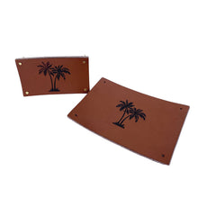 Load image into Gallery viewer, Blue 100% cotton coastal cushion with a small palm tree leather patch. Leather Patch cushion accessory.
