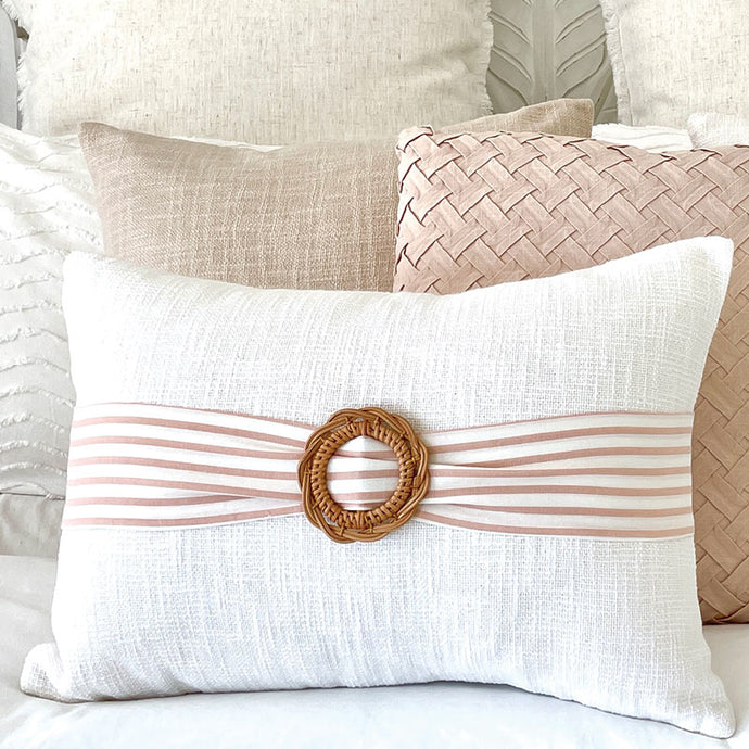 A classic style cushion in White and Pink with a Rattan Buckle cushion accessory. lumbar cushion. 35x50 size